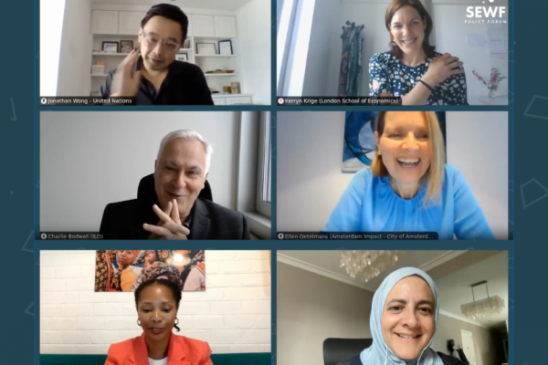 An screenshot showing a group of SEWF Policy Forum speaker talking and smiling during the event.