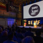 An image of a crowd of people at the launch of People and Planet First