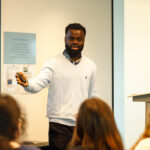 SEWF25 speaker James Okina addressing people at an event