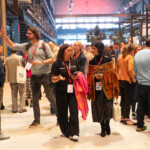What is a social enterprise? An image of two women walking through SEWF23 social enterprise market